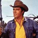 Actor Elvis Presley in a cowboy hat in the Western movie 'Stay Away, Joe.'