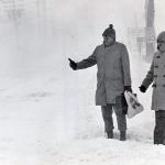Two people hitchhike during a snowstorm on Jericho Turnpike in Commack, New York on Jan. 20, 1978.