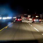 A freeway at night in traffic