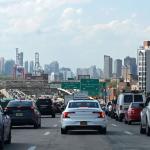 The lower Manhattan skyline is seen as a backdrop for a traffic jam on an expressway on May 15, 2020 in New York City.