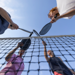 Four players on a pickleball court