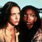 Actors Jennifer Love Hewitt and Brandy holding on to one an other with fear in their eyes in a scene from the 1998 film 'I Still Know What You Did Last Summer.'