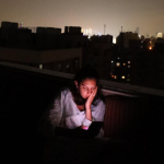Mirna El Helbawi at her home in Cairo, Egypt, during a temporary blackout. She has been working around the clock to distribute eSIMs to Palestinians in Gaza.