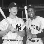 Mickey Mantle of the New York Yankees and Willie Mays of the New York Giants pose with their baseball bats at Yankee Stadium prior to the 1951 World Series.