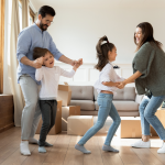 A family celebrates moving into a new home
