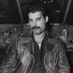 Freddie Mercury of Queen on board a train (De Kameel) from Leiden to Amsterdam, Netherlands, after a gig at Groenoordhal, Leiden, 25th April 1982. 