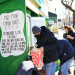 People pick up food from the Clinton Hill-Fort Greene Mutual Aid group's refrigerator on March 03, 2021 in the Fort Greene neighborhood of the Brooklyn borough in New York City. 