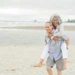 An older couple walking on the beach