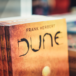 The book Dune by american author Frank Herbert on display in a library.