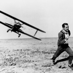 Actor Cary Grant (1904 - 1986) is pursued across a cornfield by a cropduster in the Hitchcock film 'North by Northwest', 1959. 