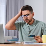 man paying online with credit card