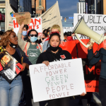 Metro Justice members, a grassroots organization advocating for public power in Rochester, New York
