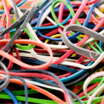 A pile of colorful rubber bands, also called gum bands in Pennsylvania