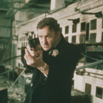 Gene Hackman as Detective Jimmy 'Popeye' Doyle points his handgun in a still from the film 'The French Connection' directed by William Friedkin.