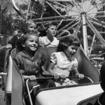 Kids enjoying a ride at the California state fair, 1953.
