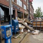 debris from flash flood piled in front of restaurant in Montepelier, Vermont
