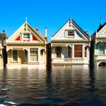 Flooded row homes in urban environment.