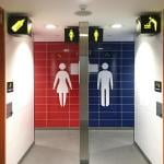 public restroom with two entrances for binary genders