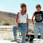 Susan Sarandon and Geena Davis standing in the convertible in publicity portrait for the film 'Thelma & Louise', 1991.
