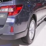 Rear view of a partial zero emissions vehicle, a gray Subaru Outback.