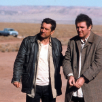 Robert De Niro stands in the desert with Charles Grodin in a scene from the film 'Midnight Run', 1988.