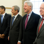 Former US Presidents George W. Bush (C), Barack Obama (2nd L), George H.W. Bush (L), Bill Clinton (2nd R) and Jimmy Carter (R) in the Oval Office of the White House in Washington, DC, on January 7, 2009. 