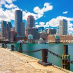 Boston, MA skyline in sunny summer day, seen from harbor.