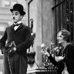Actors Charlie Chaplin as The Tramp and Virginia Cherrill as a blind flower seller in the film 'City Lights'. 