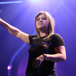 Kelly Clarkson performs on stage.