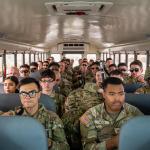 Texas Tactical Border Force guardsmen on a bus wait for departure at the Million Air El Paso ELP airport.
