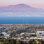 An aerial view of San Carlos and Redwood City with Mount Diablo in the background.