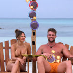 Jessica and Harry, two contestants on season 2 of the Netflix reality show 'Perfect Match,' sitting on beach chairs with the sea and blue skies behind them