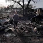 Angie Hodges searches for items in the remains of her home after it was destroyed by the Smokehouse Creek fire, which burned more than a million acres, on March 03, 2024 near Stinnett, Texas.