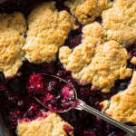 Homemade blueberry cobbler fresh out of the oven in a baking pan
