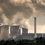 Chimneys at a coal power plant emitting smoke