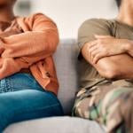 Couple on sofa in therapy considering divorce.