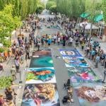 Spectators enjoy art at the Chalkfest event in Redmond, Washington.