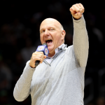 Steve Ballmer, owner of the LA Clippers, pumps up the crowd before a preseason NBA game between the LA Clippers and the Utah Jazz in 2023 in Seattle, Washington.