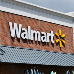 Exterior view of a Walmart store, with the logo against a brick wall 