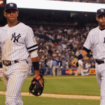 Alex Rodriguez #13 (L) and Derek Jeter #2 of the New York Yankees walk back to the dugout at Yankee Stadium, circa 2008