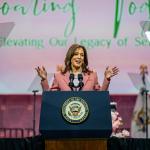 Vice President Kamala Harris wearing a pink suit speaks to Alpha Kappa Alpha Sorority members at the Kay Bailey Hutchison Convention Center on July 10, 2024 in Dallas, Texas.