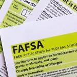 Overhead view of stacks of paper FAFSA forms.