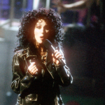 Cher performs her song 'If I Could Turn Back Time' on the battleship USS Missouri for the music video of the song