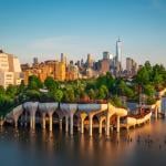 Little Island over the Hudson River in Chelsea, New York at dusk, with the lower Manhattan skyline in the backdrop.