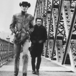 Hoffman and Jon Voight cross New York's Willis Avenue Bridge in a scene from the film 'Midnight Cowboy'