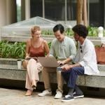 Diverse group of young adults having a financial discussion.