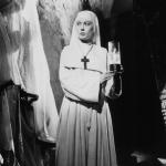 Actor Deborah Kerr holds a candle in a scene from the 1947 film 'Black Narcissus.'