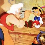 Gepetto paints Pinocchio sitting next to his cat Figaro in the 1940 movie 'Pinocchio.'