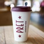 A paper coffee cup is seen on a table in Pret A Manger shop in Manhattan in 2024.