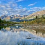 A view of the mountain tops and lake in St. Elias National Park in Wrangell, Alaska.